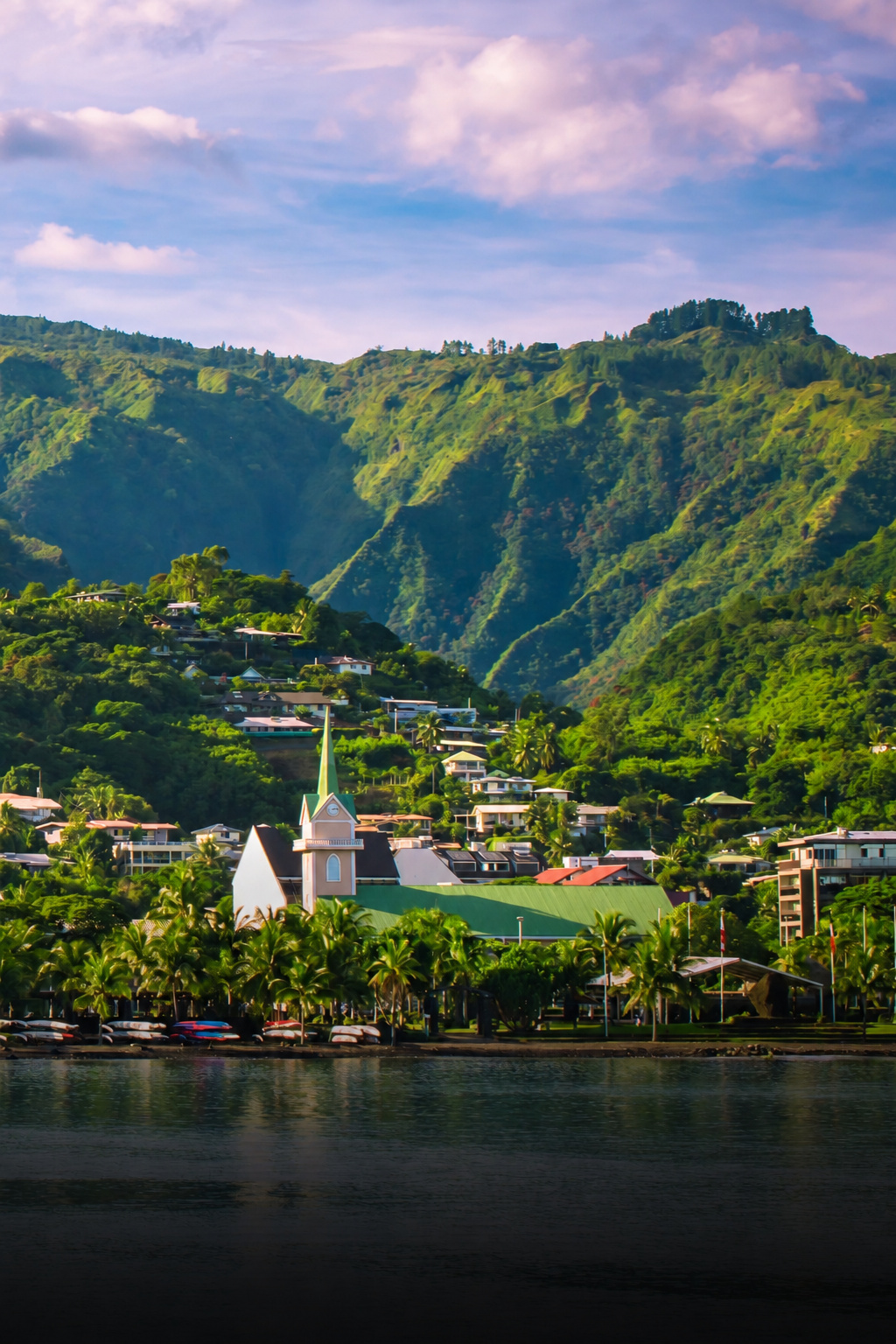 Papeete waterfront beneath lush Tahitian mountains