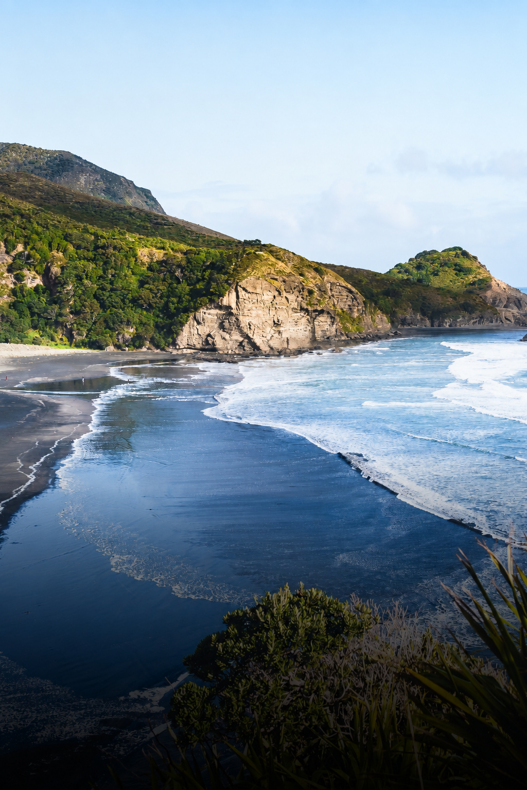 Piha Beach and rocky coastline near Auckland