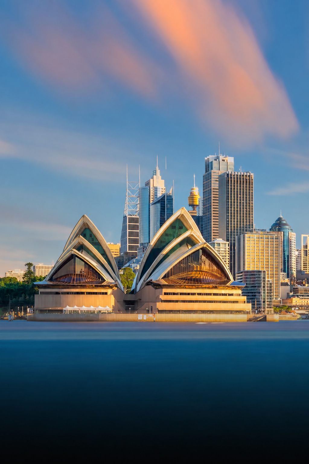 Sydney Opera House and skyline at sunset