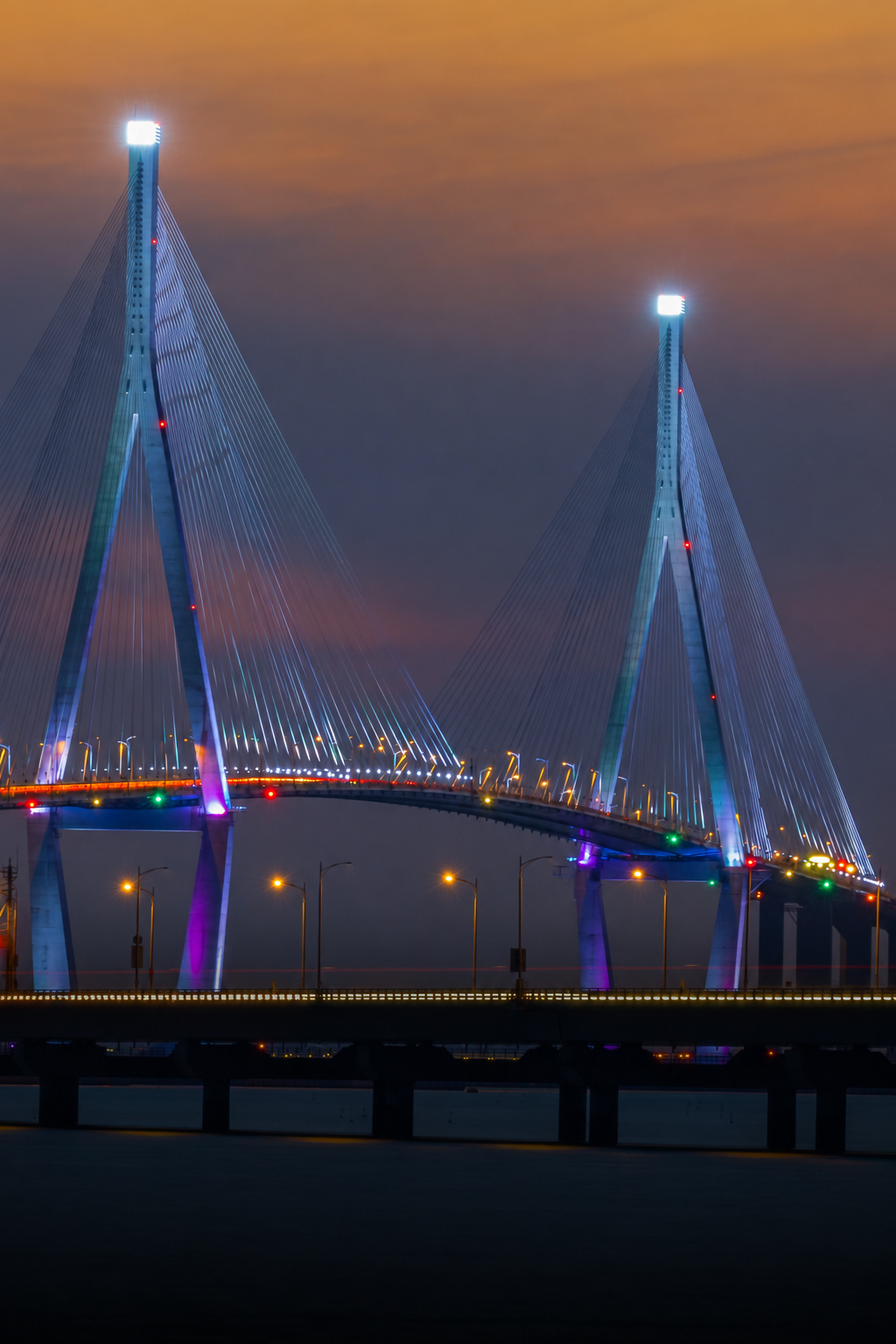 Illuminated Incheon Bridge at dusk