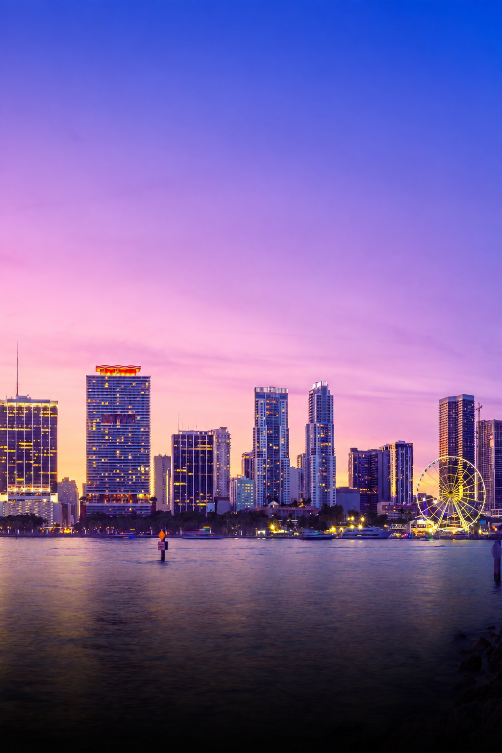 Miami skyline across Biscayne Bay at sunset