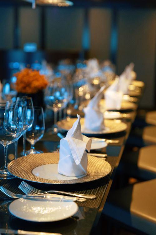 Elegantly set table for specialty dining onboard