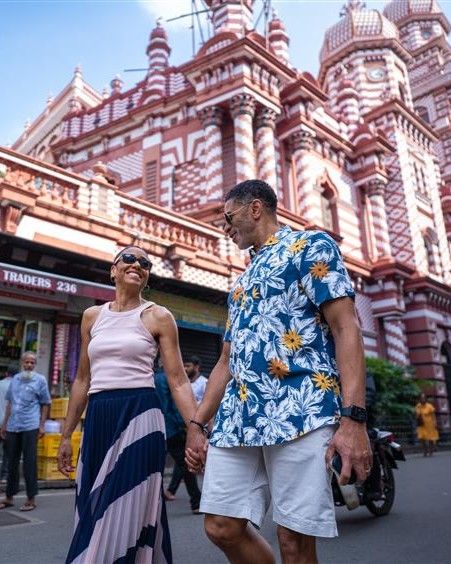 Couple exploring a colorful temple on a shore excursion