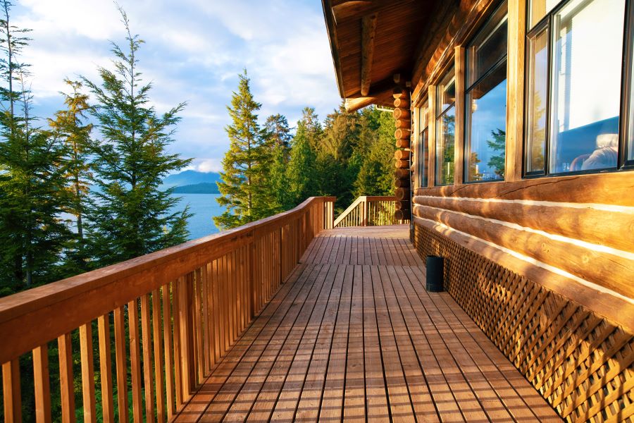 Rustic log cabin overlooking forested coastline in Ketchikan, Alaska, a scenic stop often featured on Alaska cruise itineraries.