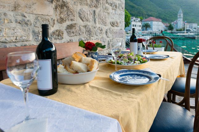 Outdoor table with wine and lunch in Montenegro