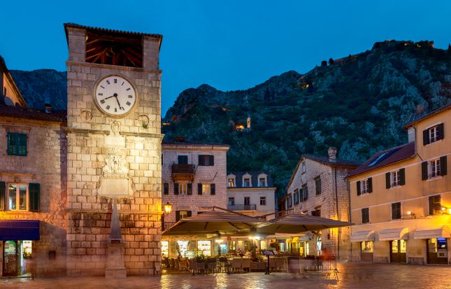 Kotor Old Town clock tower and square at night