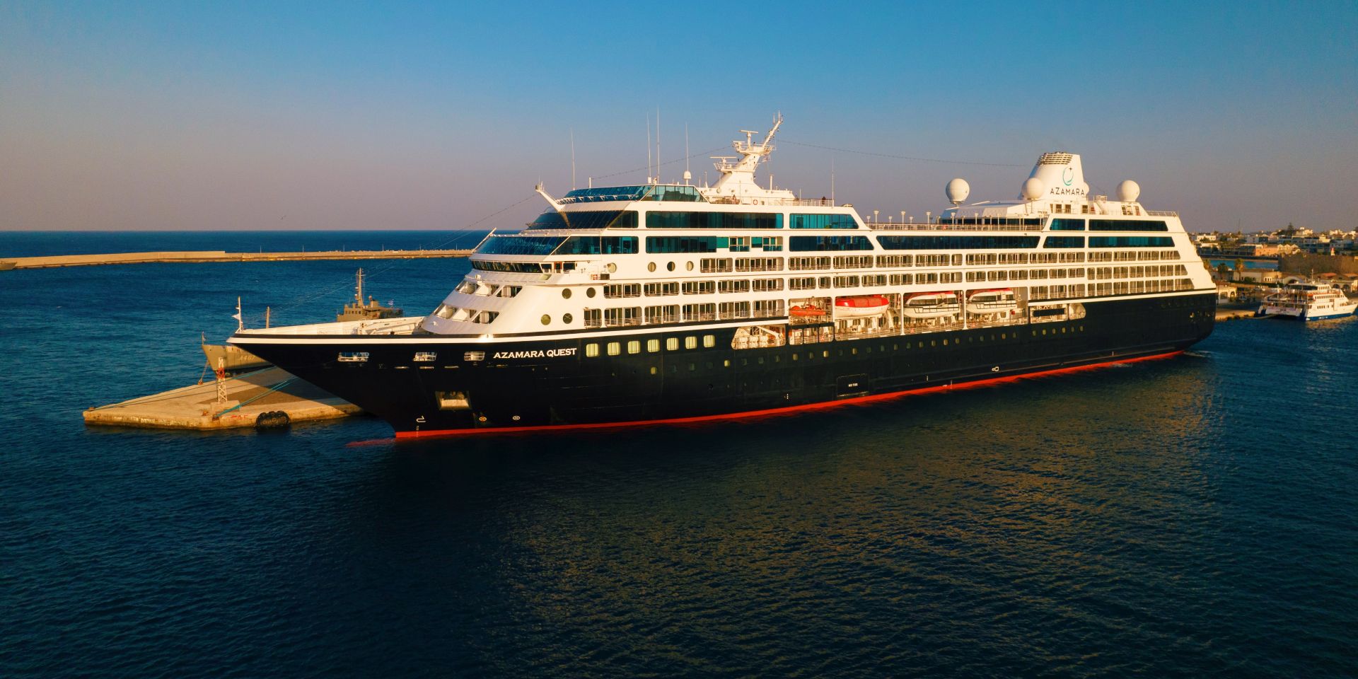 Azamara Quest docked at golden hour in Rhodes, Greece, ahead of the 2029 World Cruise Collection