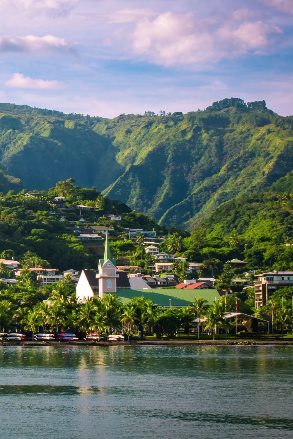 Papeete waterfront beneath lush Tahitian mountains
