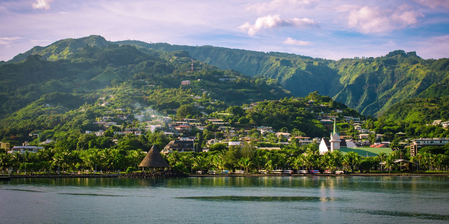 Papeete waterfront beneath lush Tahitian mountains