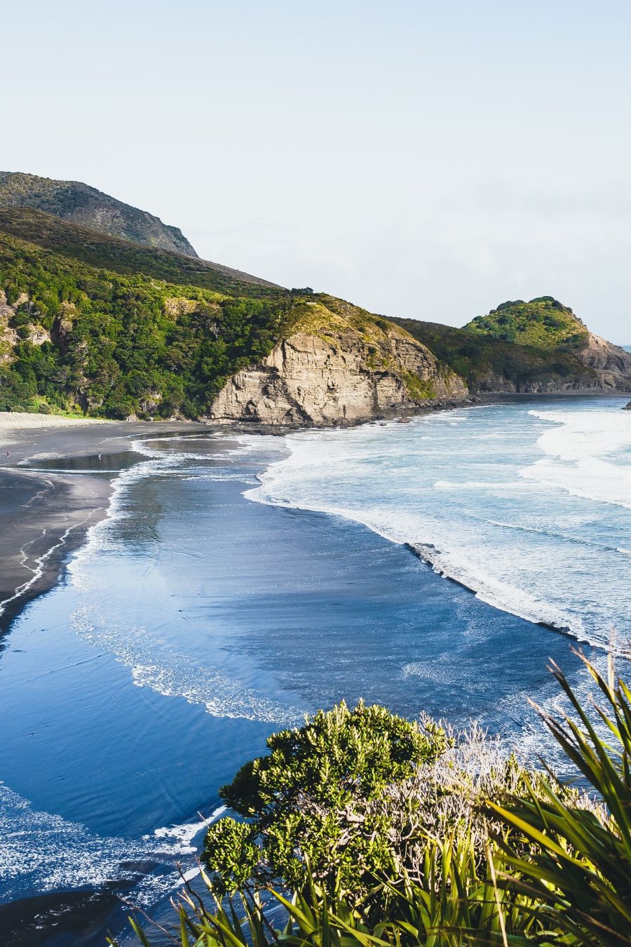 Piha Beach and rocky coastline near Auckland