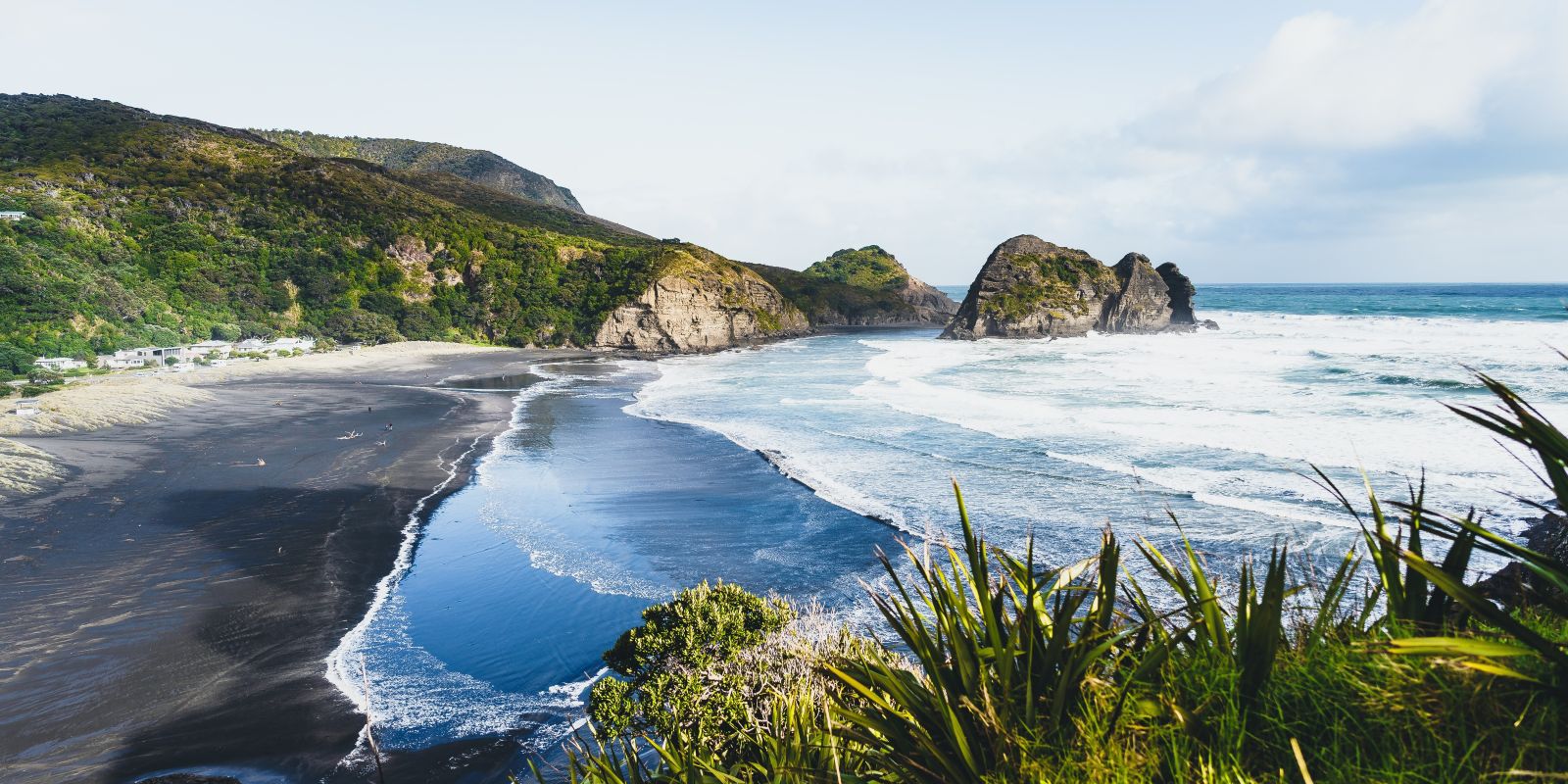 Piha Beach and rocky coastline near Auckland