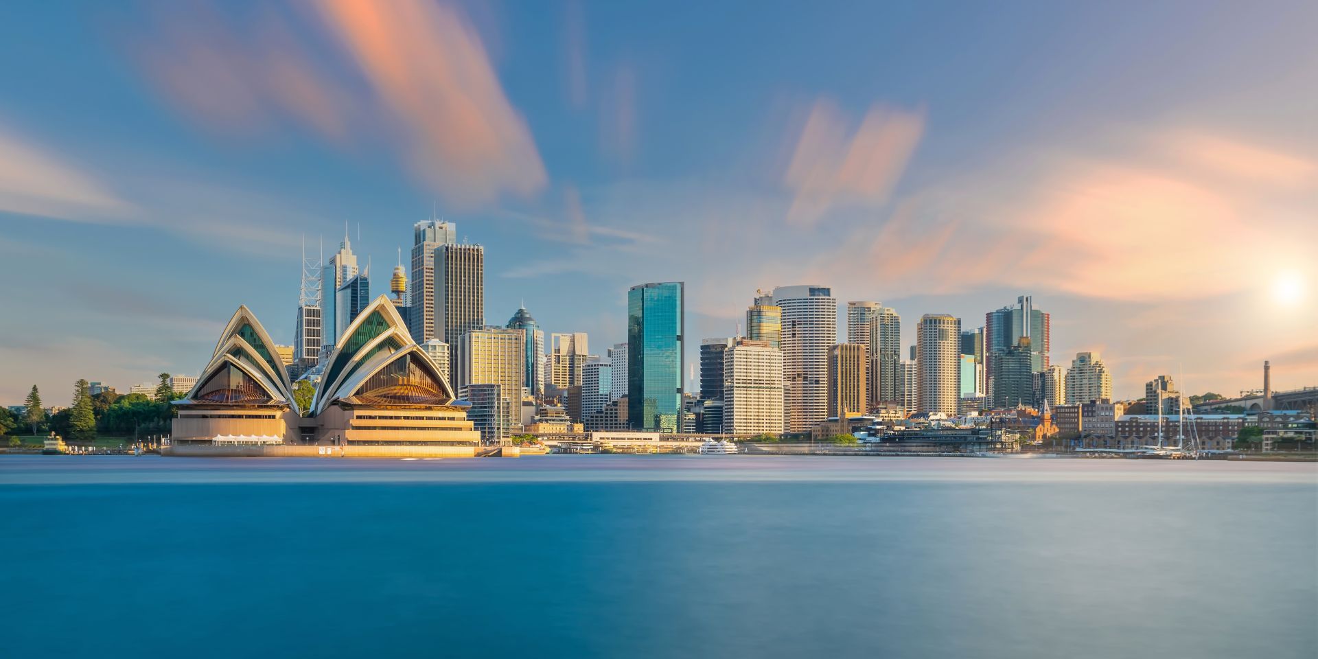 Sydney Opera House and skyline at sunset