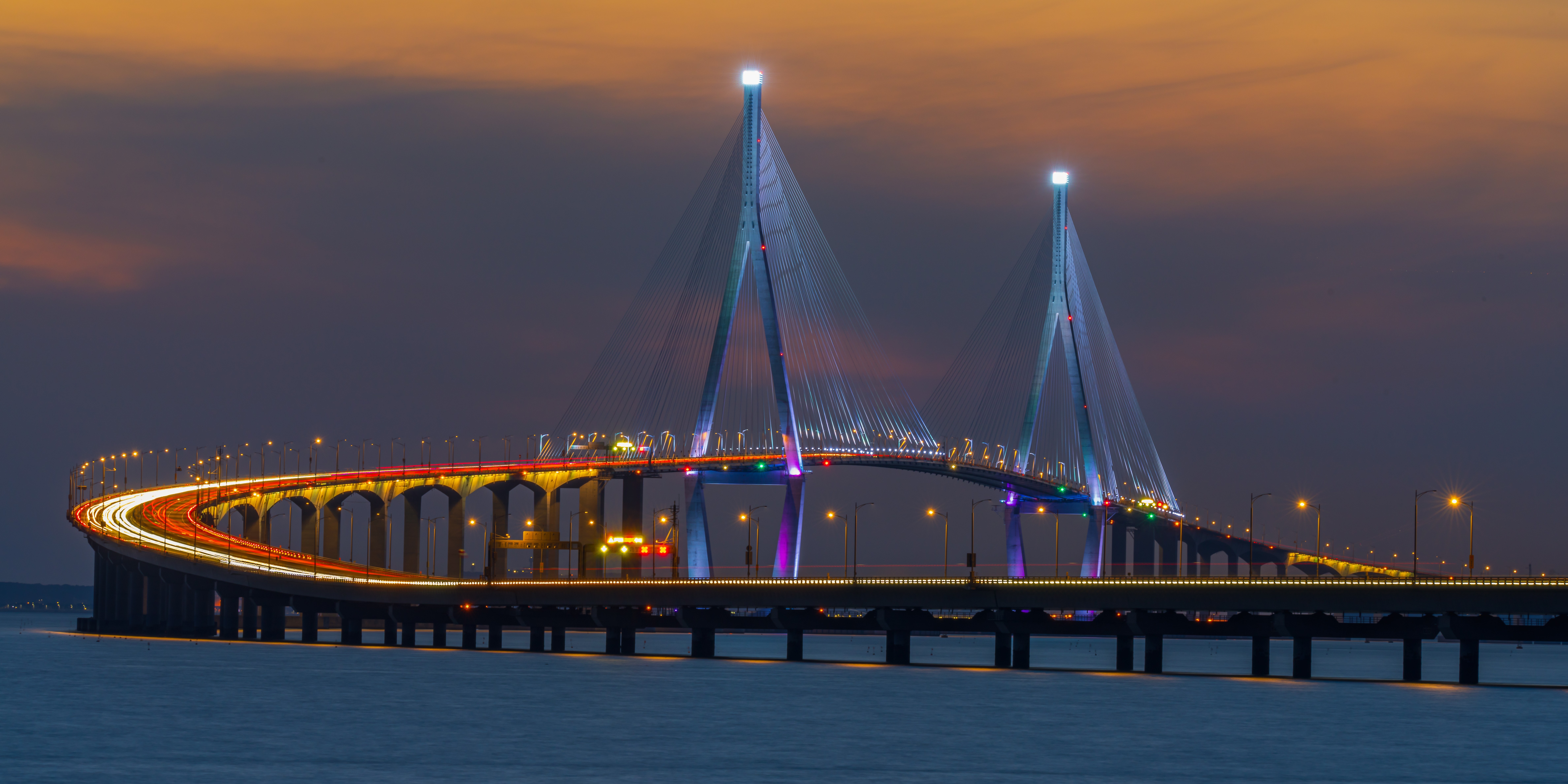 Illuminated Incheon Bridge at dusk