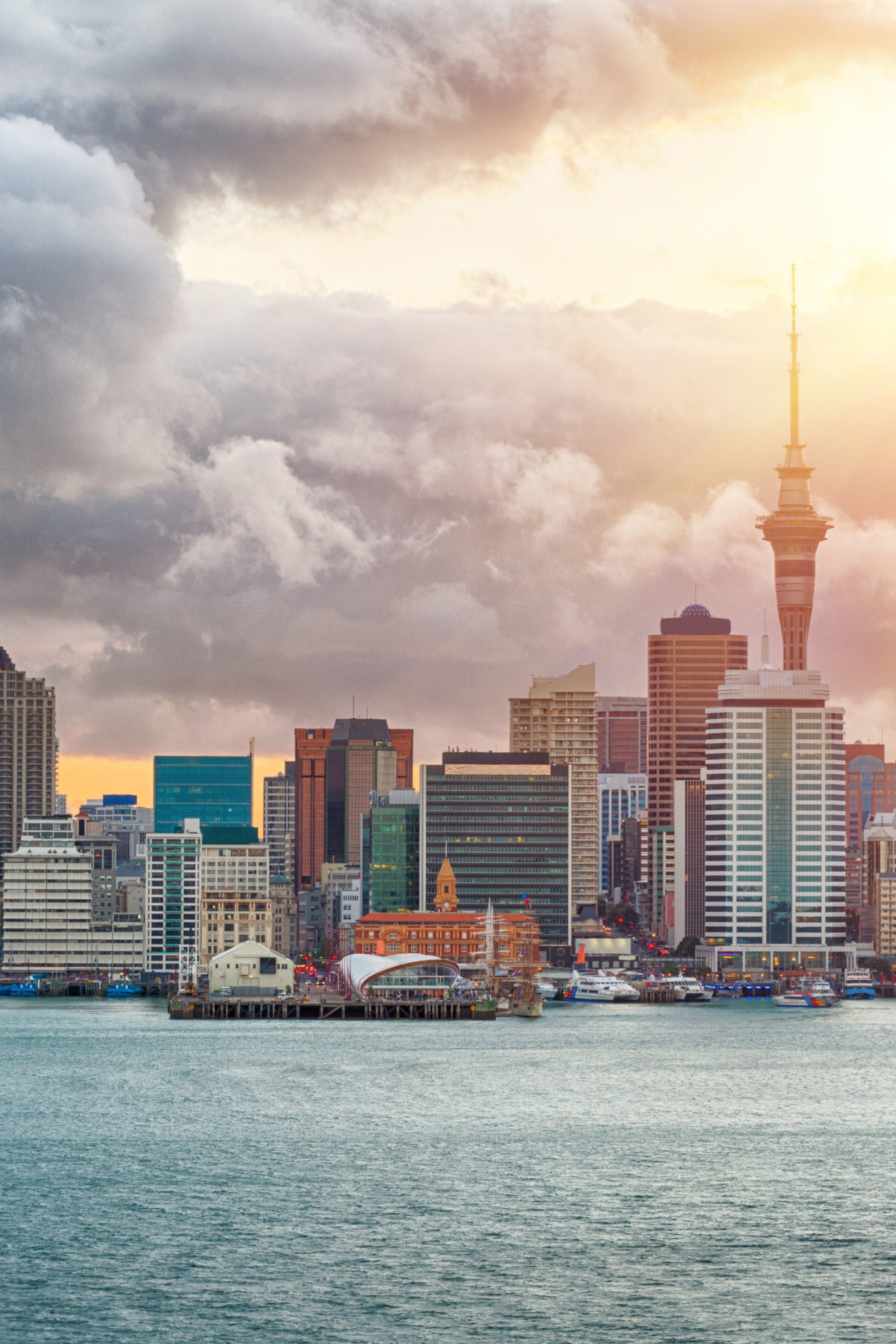 waterside cityscape with clouds in background