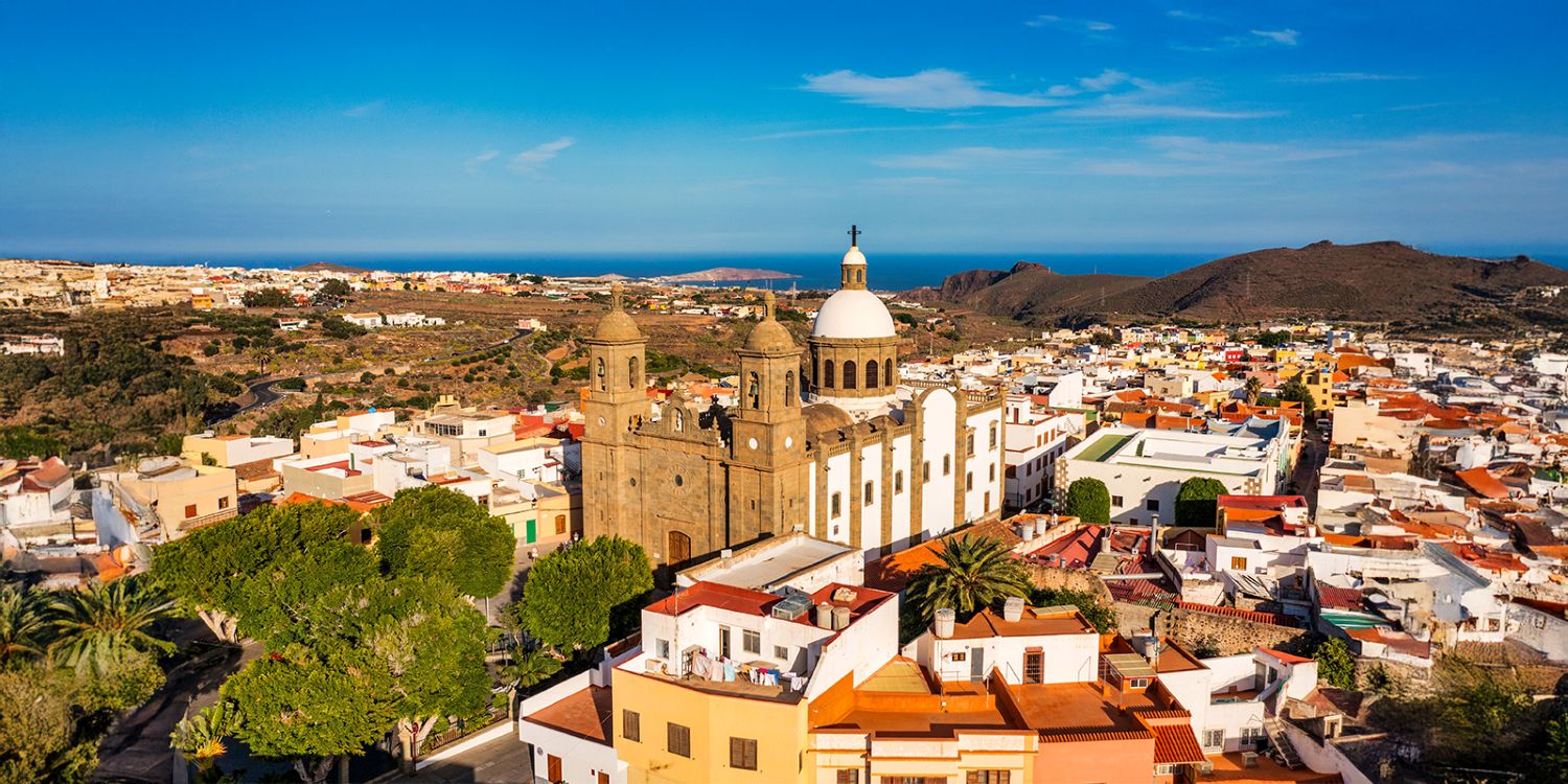 Gran Canaria, Canary Islands aerial view of historic Arucas with its cathedral and surrounding coastline.
