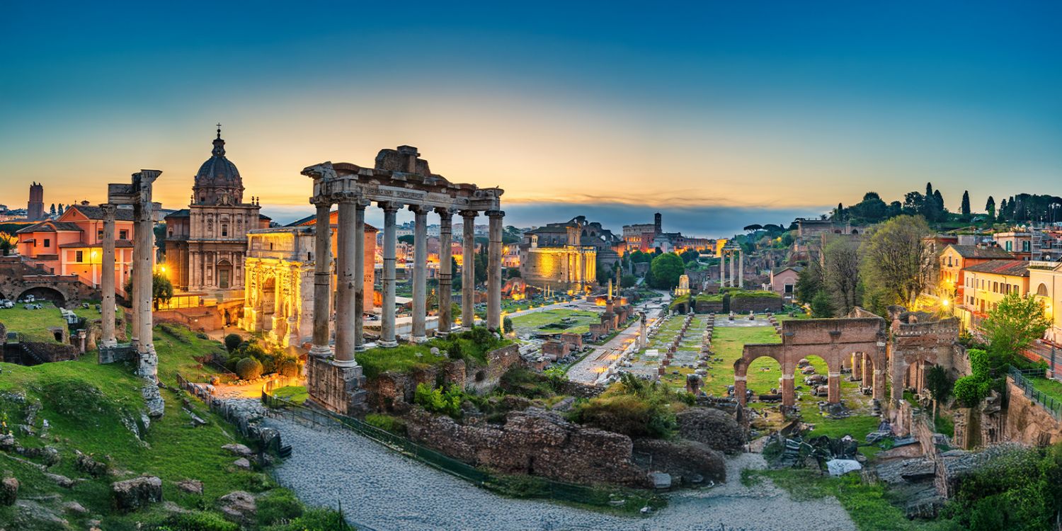 Rome, Italy sunrise over the Roman Forum with ancient ruins and historic architecture.
