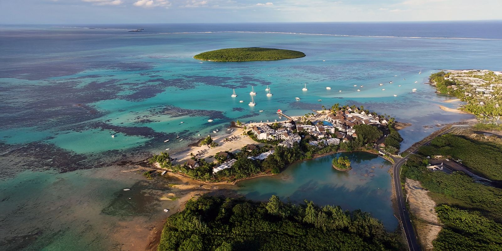 Port Louis, Mauritius coastline with turquoise lagoon waters, small islands, and beachfront resorts