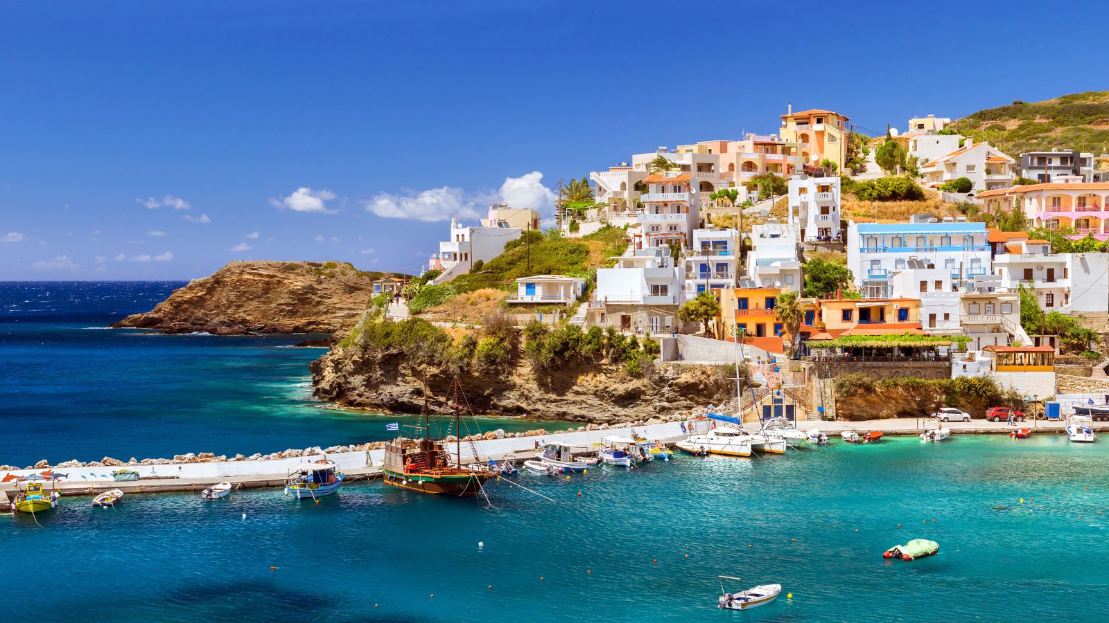 seaside town with dock and boats