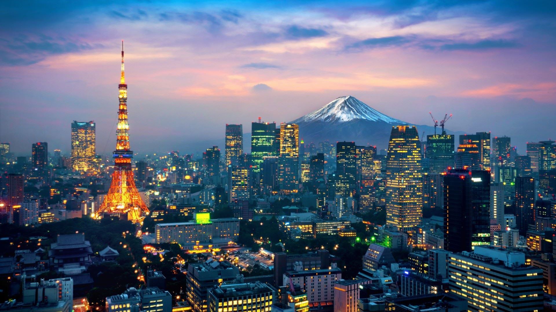 mountain peak behind skyline at dusk