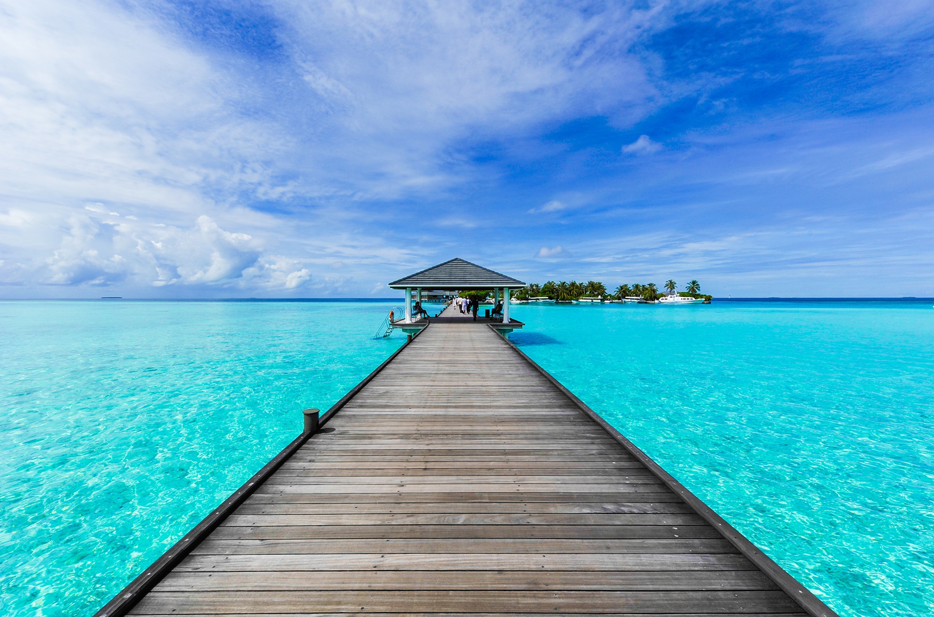 long dock jutting out into clear blue water