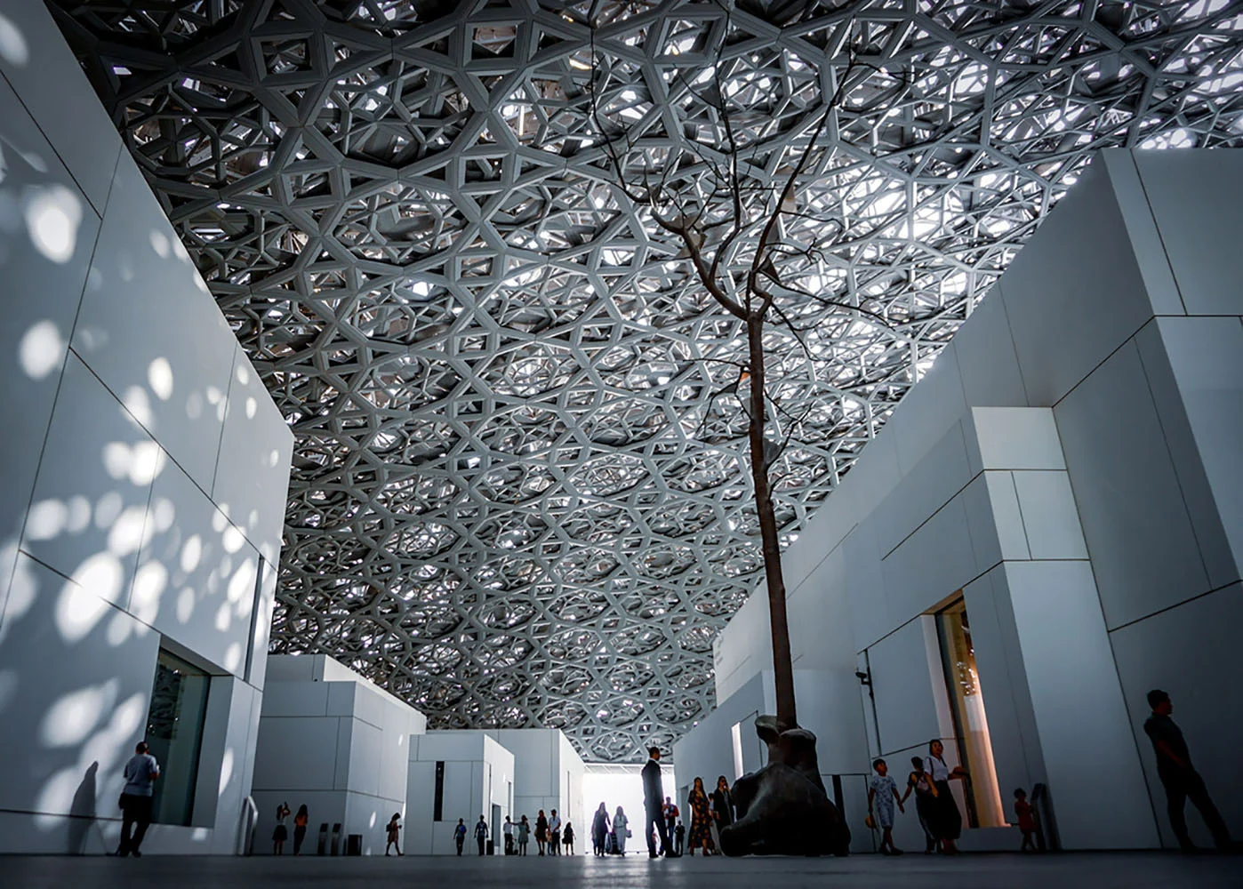 The interior of Louvre Abu Dhabi, showcasing its signature ceiling
