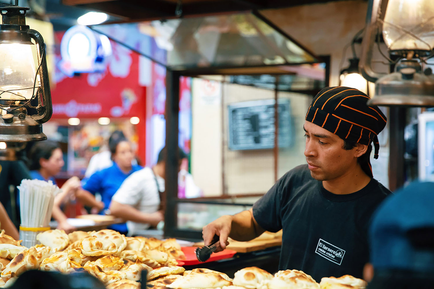 A man works in a food market in South America