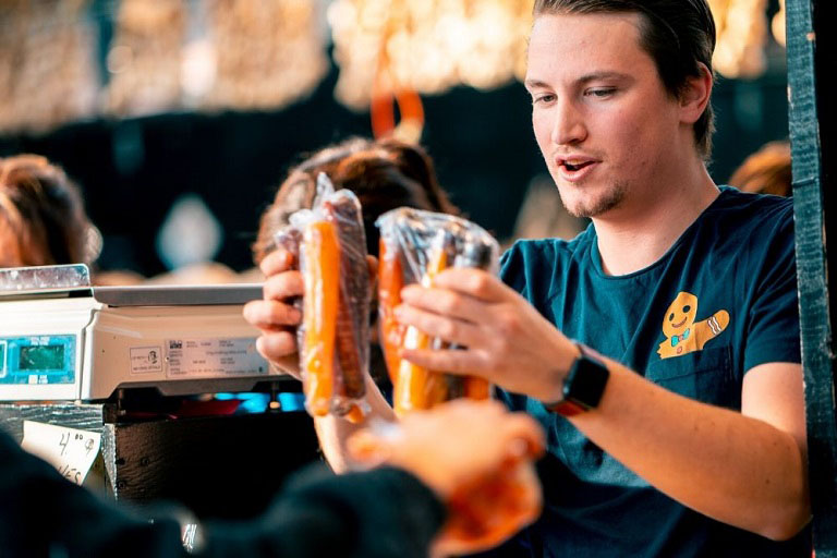 Buying food at local market stall