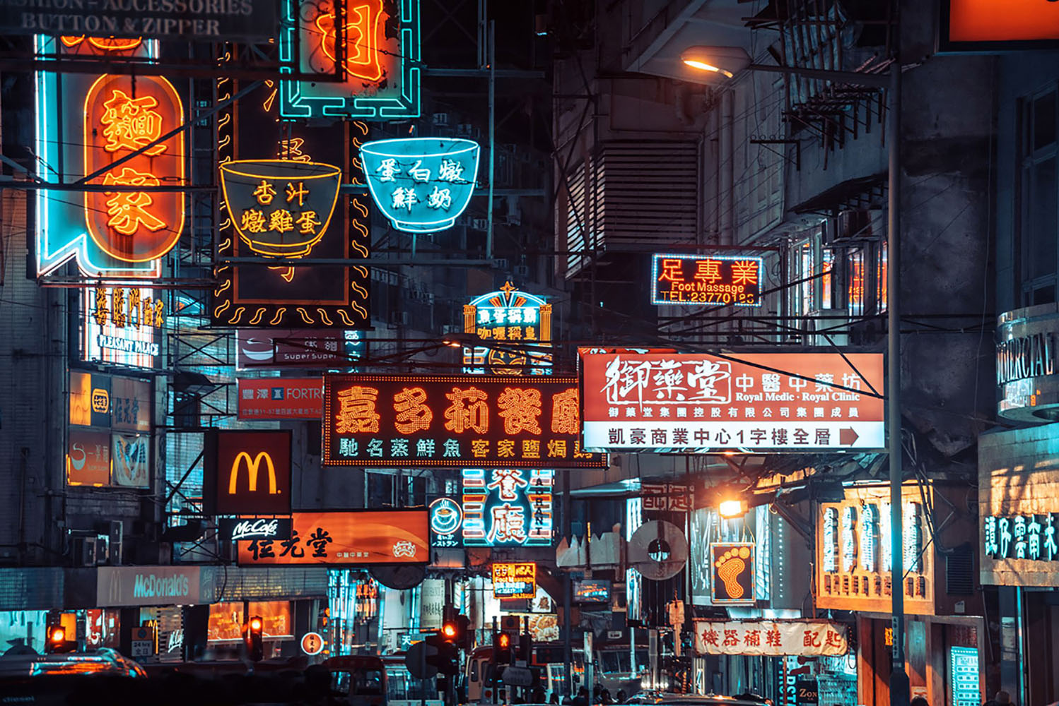 Colorful neon signs light up a street in Hong kong