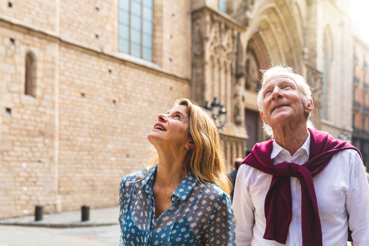 A senior couple visits Old Town in Barcelona