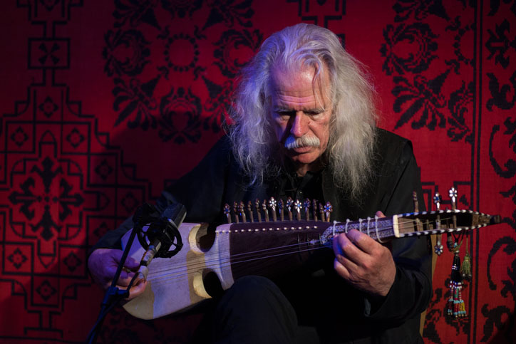 A man plays the Cretan lyra in Greece