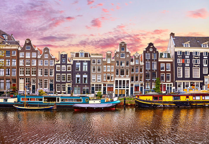 Dutch Houses reflections at night on the water of the canal