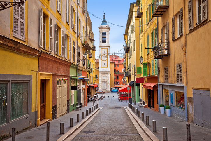 Colorful street architecture and church view in Nice, France