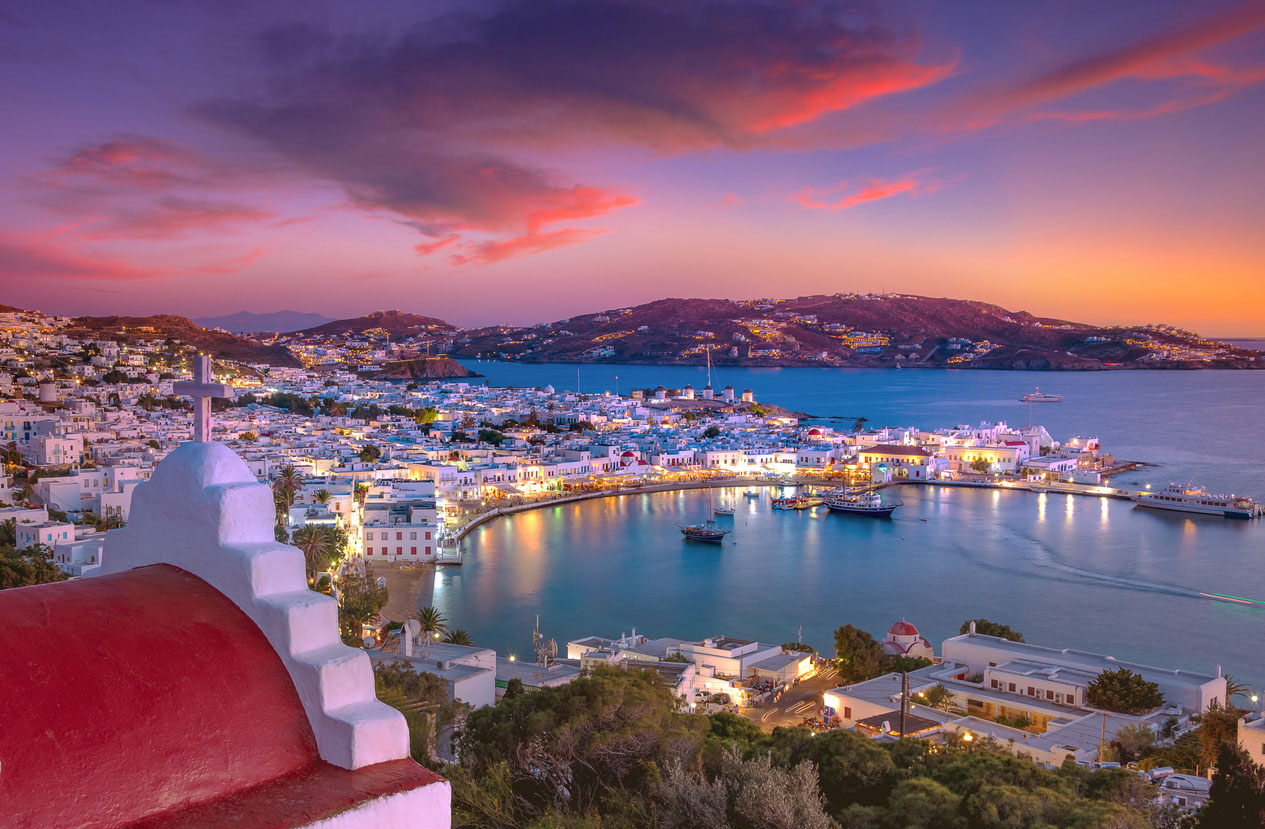 Mykonos port with boats and windmills at evening, Cyclades islands, Greece
