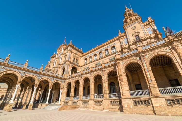 A close up image of the architecture of the main building at the Plaza de España in Seville, Spain