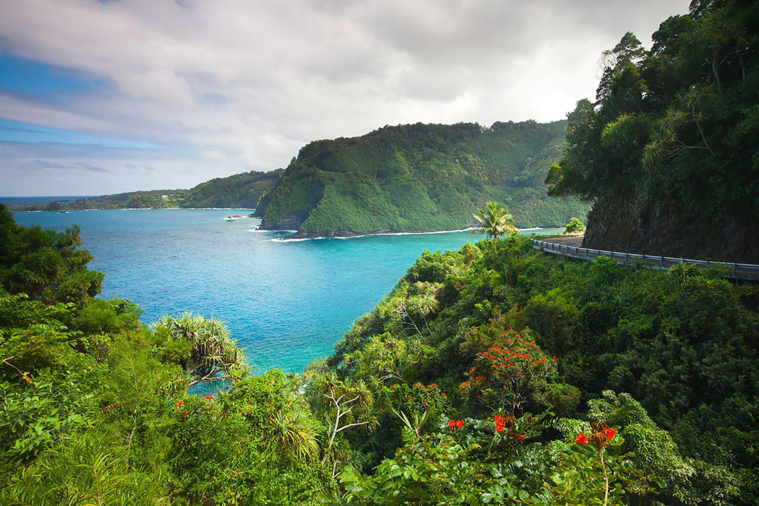 A road known as "The Road to Hana" makes its way along the shore in Maui, Hawaii