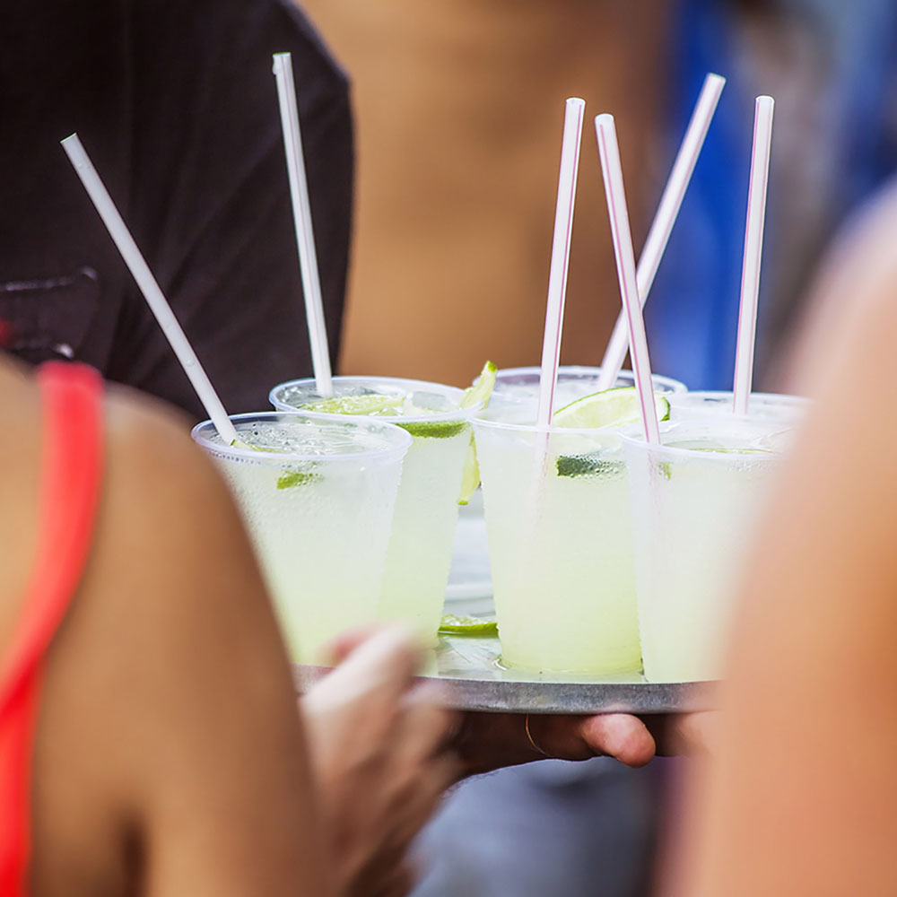 Attendees of Rio's Carnival are served cocktails.
