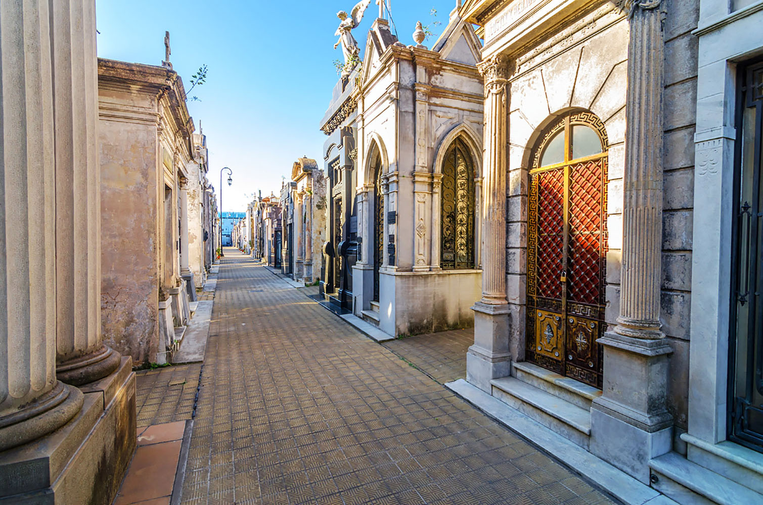 The narrow laneways of Recoleta Cemetery on a clear sunny day