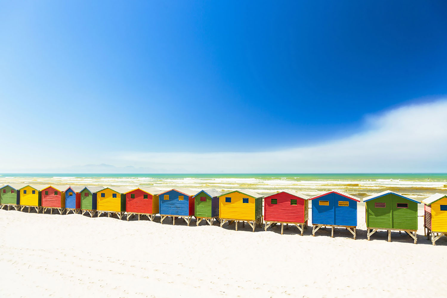 Colorful huts at Miuzenberg Beach in Cape Town, South Africa.