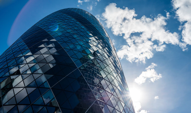 The sun shines on the Gherkin in London