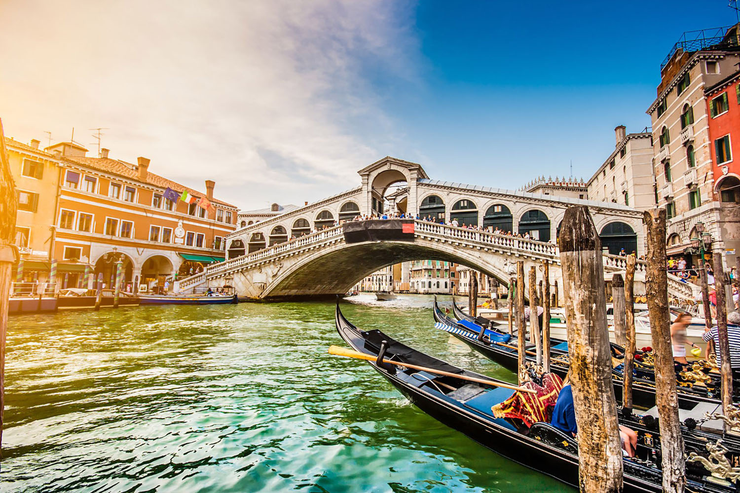 Venice's famous Rialto Bridge at sunset.