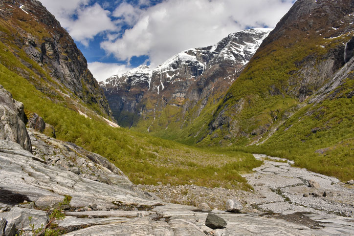 Trough Valley with headwaters of river Kjenndalselva below Kjenndalsbreen Glacier in Kjenndalen Valley, Norway.