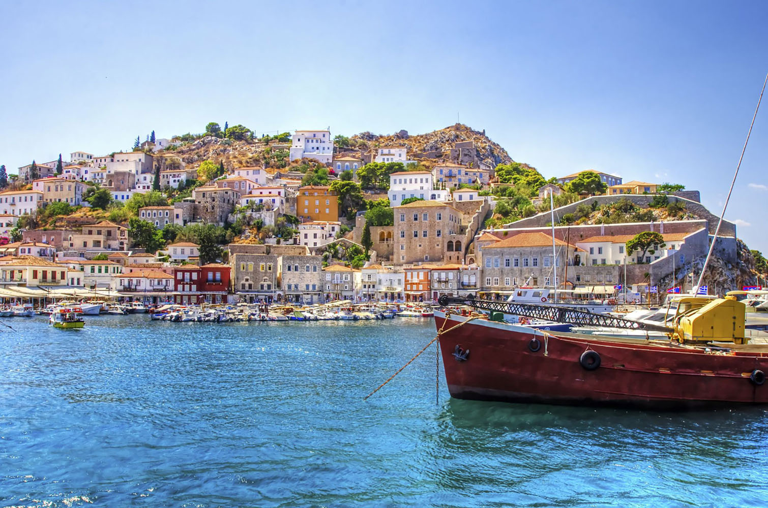 The Greek island of Hydra with a fishing boat in the water
