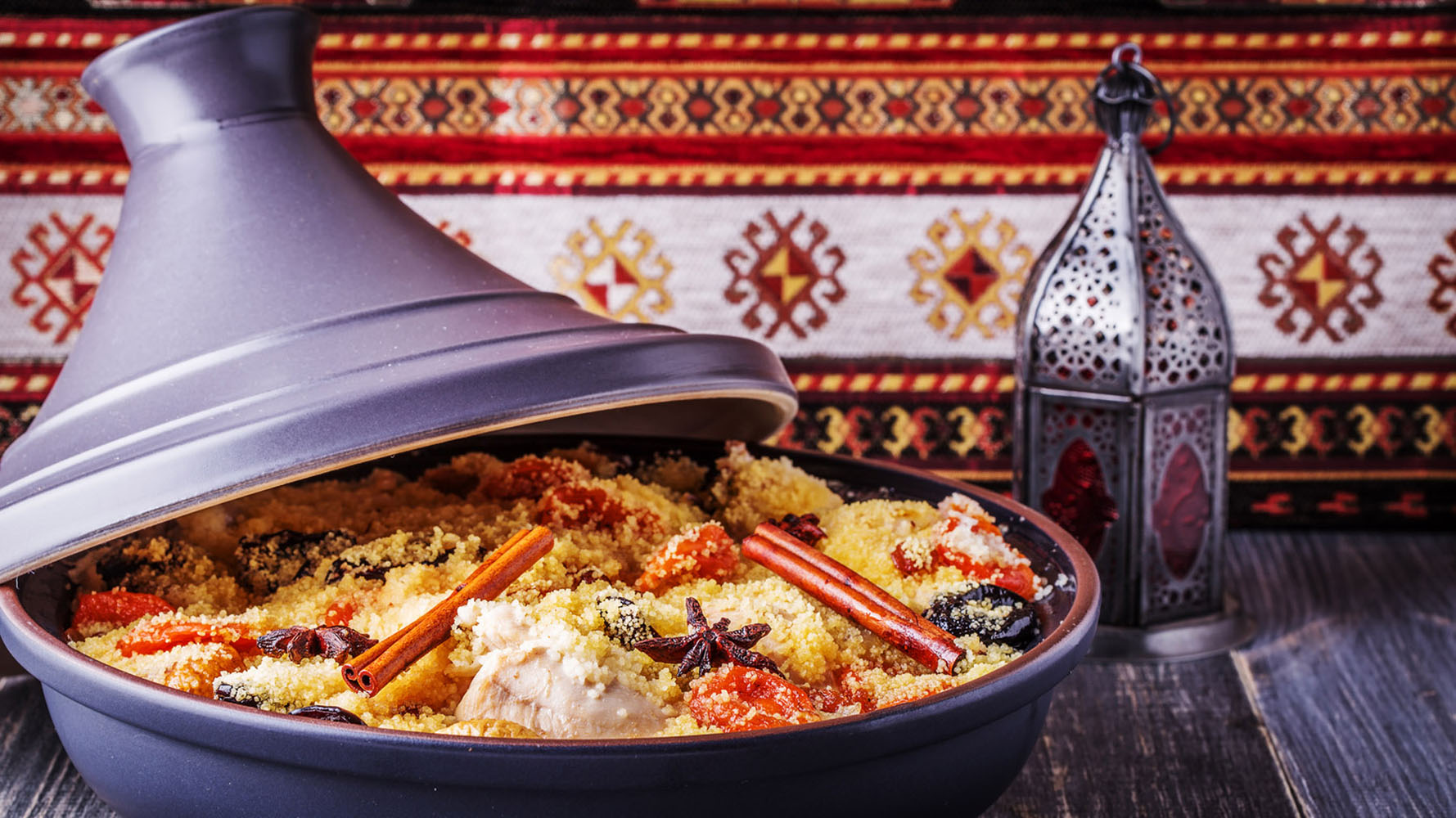 Traditional moroccan tajine of chicken with dried fruits and spice