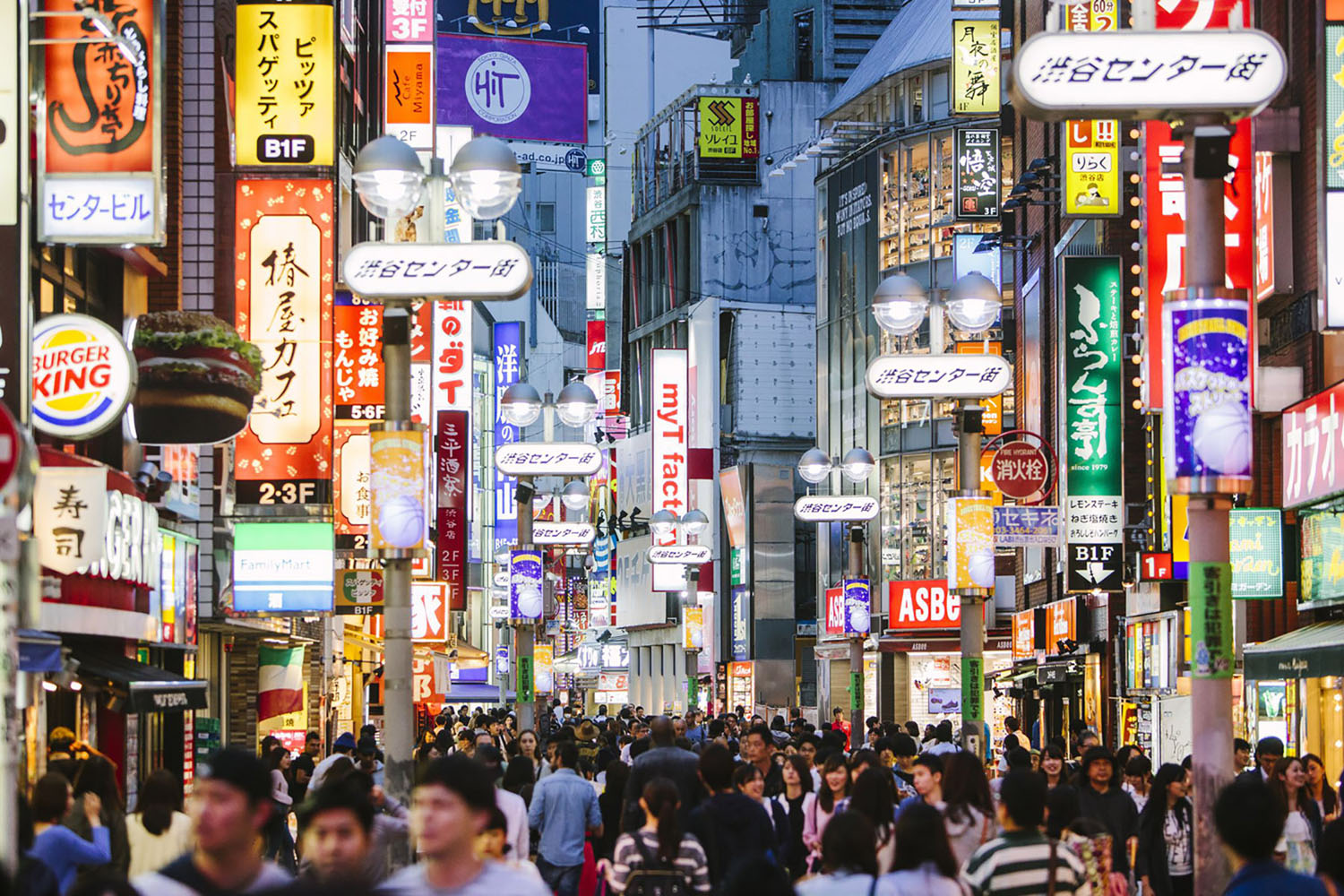 People walking in Shibuya shopping district.