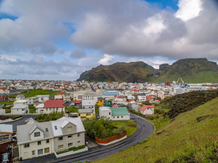 Cluster of houses in front of mountain at Heimaey, Vestmannaeyjar, Iceland