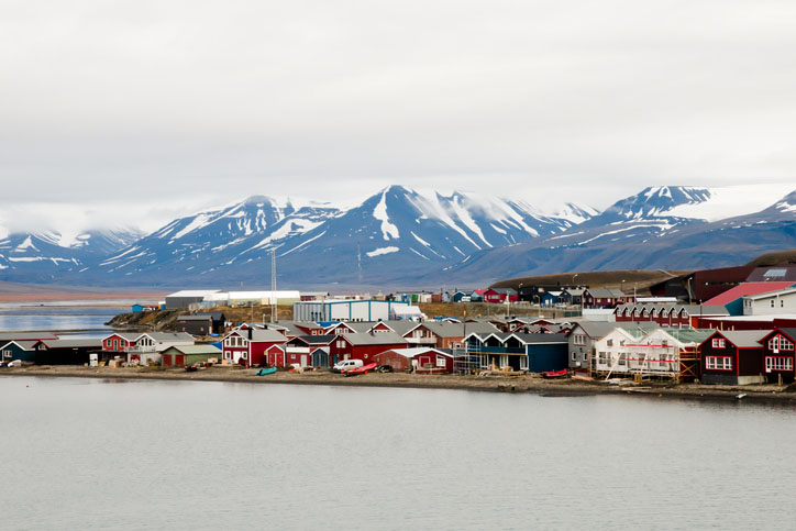 Longyearbyen with snow-capped mountains in the background
