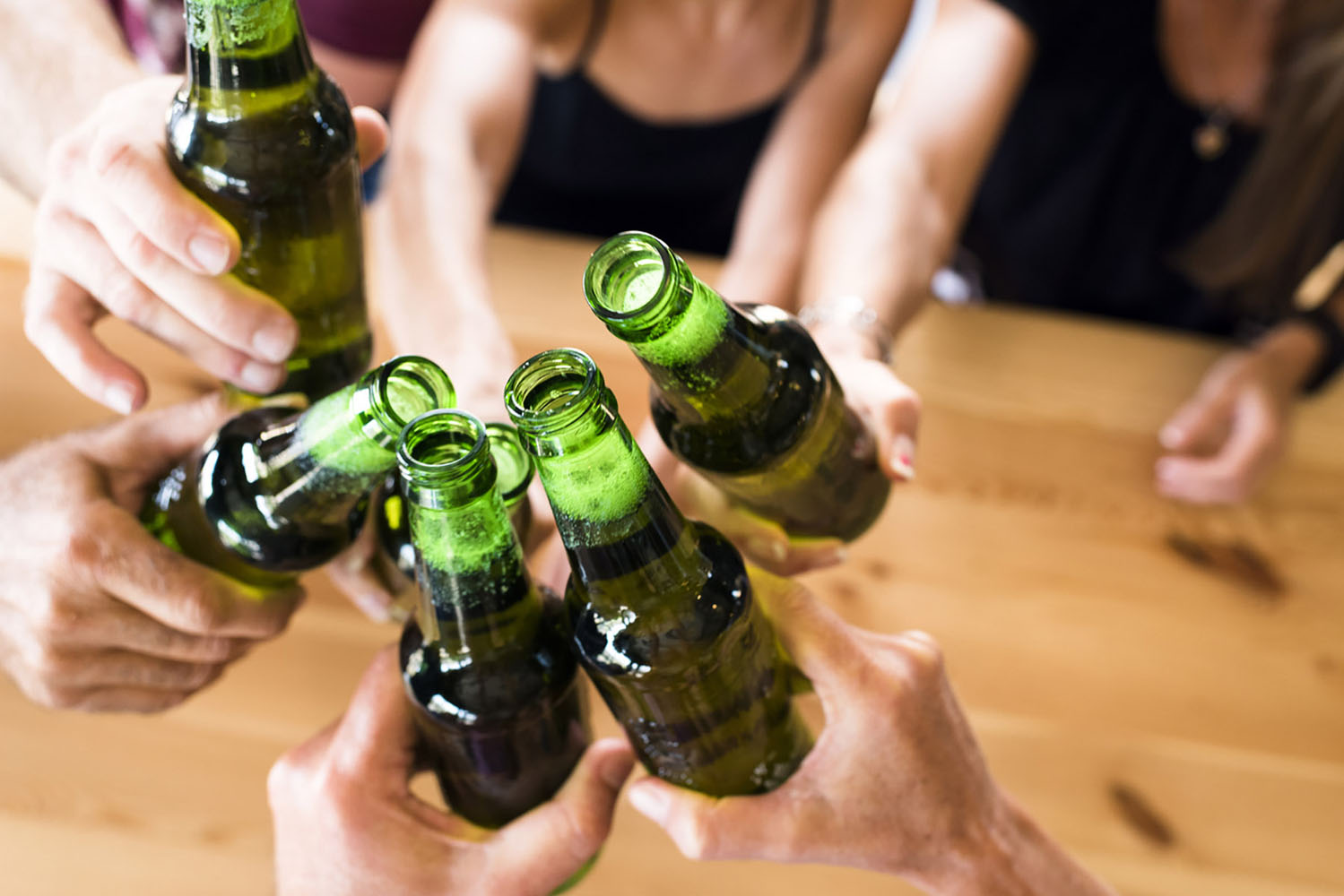 Group Of Friends Toasting At An Indoor Brewery