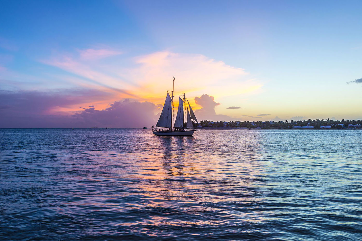 Sunset at Key West with a sail boat on the water