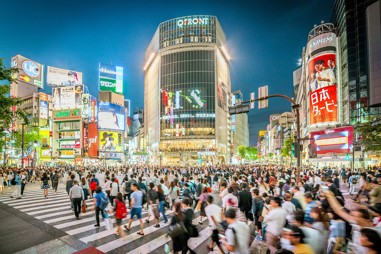 A bustling intersection in Japan at night