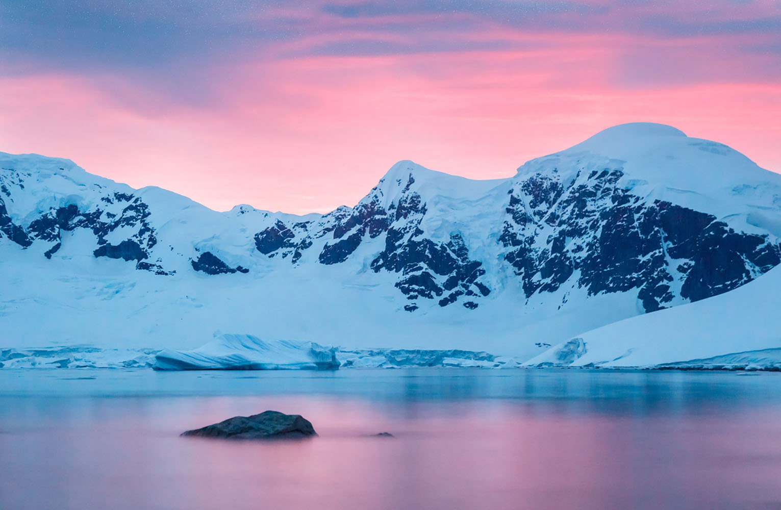 A bright pink sunset in Antarctica.